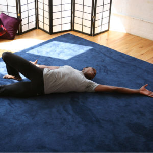 What is the feldenkrais method - man stretching on the floor